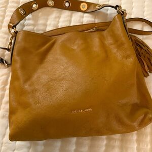 Beautiful color MK purse  
This is great to Carry if you’re a Steelers fan !